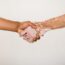 Handshake showing support between a person with vitiligo and another, symbolizing inclusive care at Cutis Institute in Calicut, Kerala—a leading skin hospital and aesthetic clinic offering advanced dermatology services including vitiligo treatment, melanocyte transplantation, acne and burn scar care, Botox, face lift, PRP, GFC, keloid treatment, pigmentation correction, trichology, hair transplant, peels, laser therapies (Ultra Plus, Excimer, Carbon, Plus dye), Exosome therapy, regenerative medicine, and consultations with expert dermatologists like Dr. Salim, Dr. Prasannakumar, Dr. Laila, Dr. Hafiz, and Dr. Kadhar.